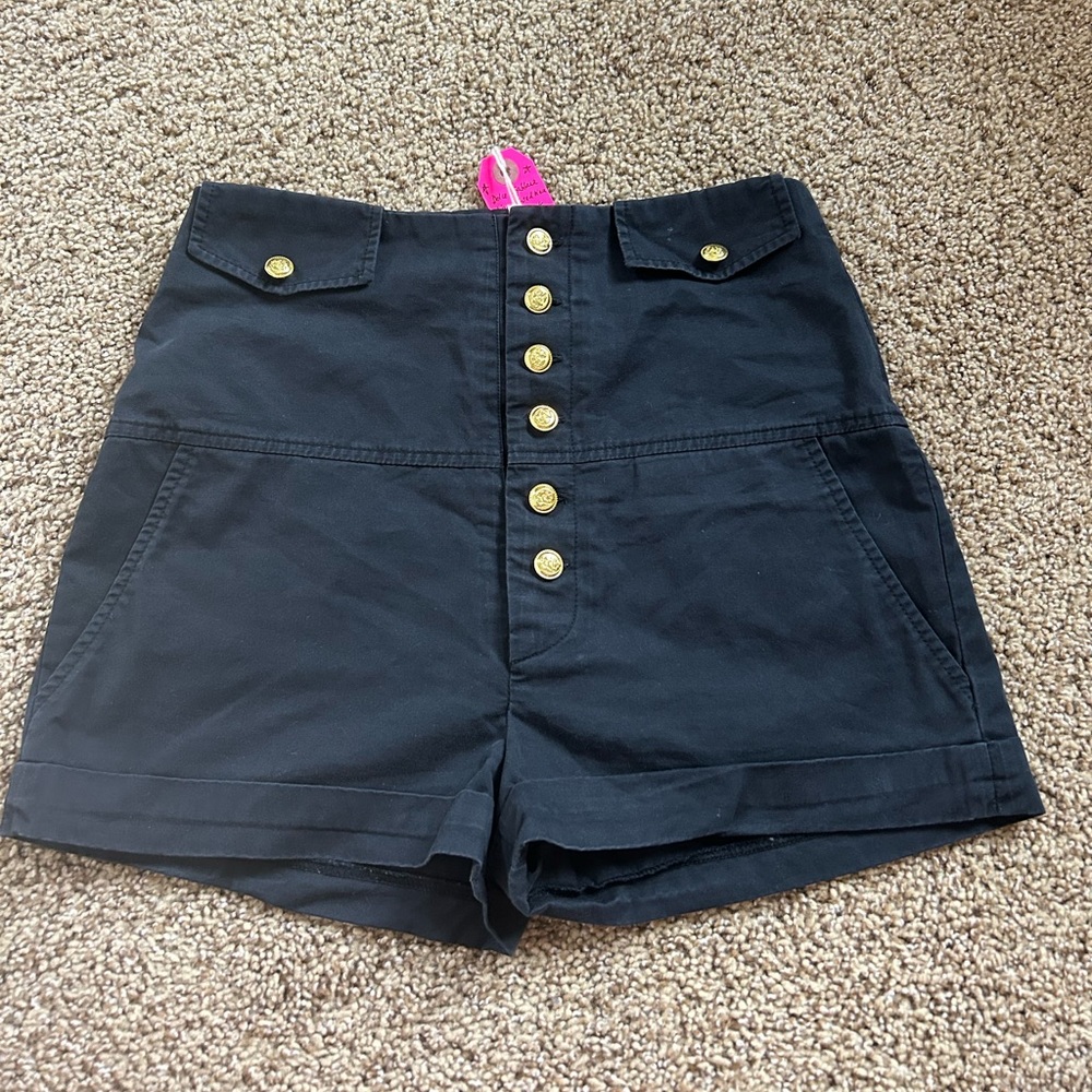 Dolce & Gabbana high-waisted black shorts with gold buttons